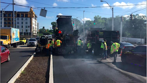 An image showing a new complete street roadway project in Atlanta with new bike lanes and safety measures.