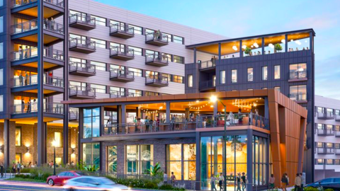 A rendering showing a large new apartment building with glassy storefronts in Atlanta on a busy street with many balconies behind a smaller modern building.