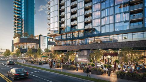 A rendering with two news glassy buildings and much activity at the base near a wide street in downtown Atlanta. 