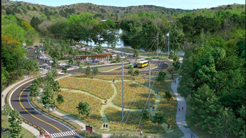  An image of a large greenspace beside a river where a new park is planned.