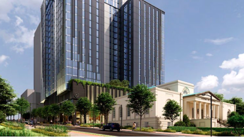 A rendering of a large tower with glass and stucco standing over large streets and a white old building in Midtown Atlanta.