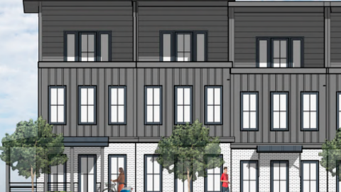 An image of a former vacant site with slimmer three story townhomes in the pipeline with three stories and rooftop patios, next to a wide boulevard in Southeast Atlanta.