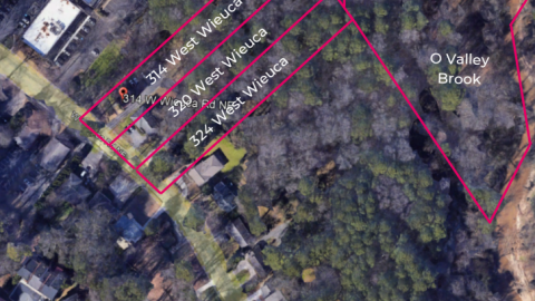 An image showing four properties next to each other for sale in Buckhead Atlanta under large trees.