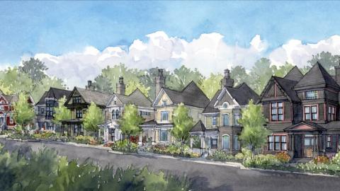 An image showing a large new community of traditional-style homes in a planned community south of Atlanta, under blue skies.