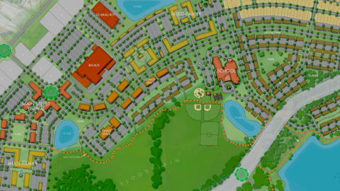 An overview of a huge new development plan with many houses, a school, lakes, and buildings for businesses.