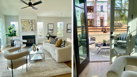 A photo of a large modern new living room with white walls and a new townhome flank being built across the street.