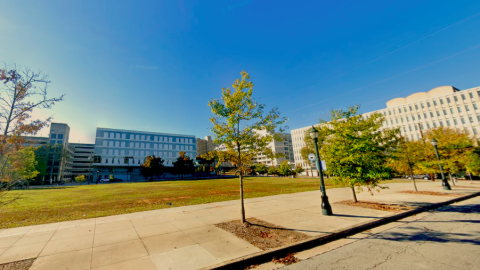 A photo of a blank slate of land surrounded by wide streets and tall hospital buildings in Old Fourth Ward Atlanta. 