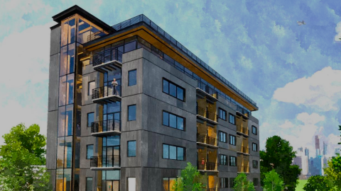 An image of a corner site where a bland and wood-clad six-story apartment building is planned near downtown Atlanta. 