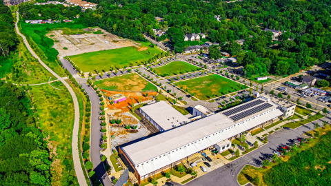 An image showing a large development site near a wide trail and many trees near downtown Atlanta.