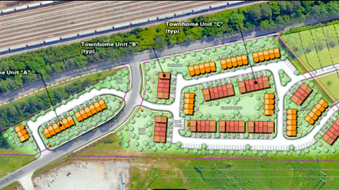 An overview image of a large development site northwest of downtown Atlanta shown near rows of railroad tracks.