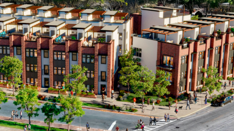 An image of a large development site where townhomes are being built near the Westside Trail Beltline next to two wide streets.