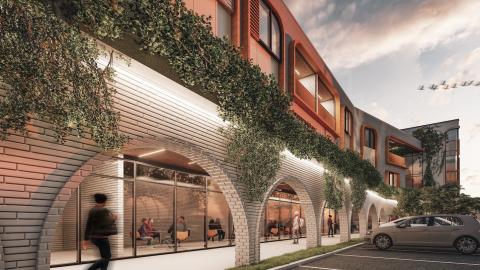 A rendering of a large new building under dark skies in Atlanta, with big arches.