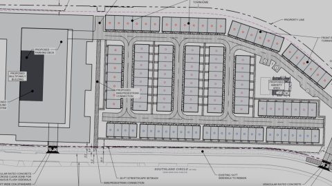 An overview image of a large block of townhomes and apartments in Atlanta near wide streets.