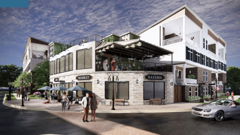 An image of a corner site with a mix of restaurant retail and three-story townhomes on two wide streets, under blue skies, across the street from MARTA.