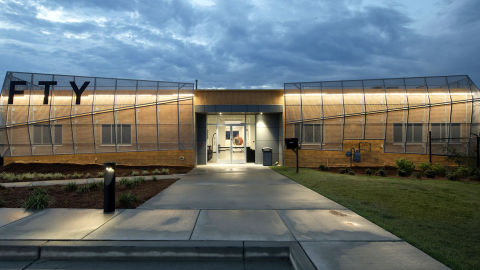 An image showing a smaller airport just west of Atlanta with modernized new buildings and a long runway.