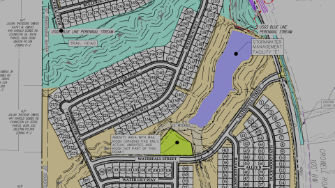 An image showing a large mix of housing with many twisty streets and ponds near an interstate east of Atlanta.