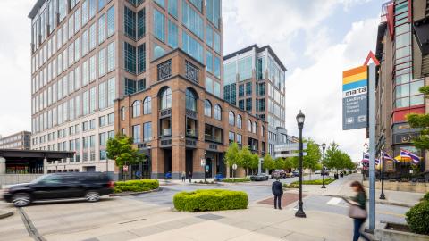 A photo of an office building space under gray skies in Atlanta near tall buildings. 