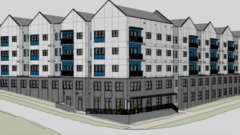 An image of a site where a large white and blue workforce development apartment project is being built north of Atlanta, Georgia.