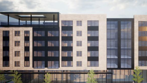 A large development project shown in beige and glass under cloudy skies in Atlanta, near wide streets.