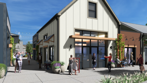 A rendering of a new village of large apartment buildings and shops in small buildings with multi colors under blue skies around a town green.