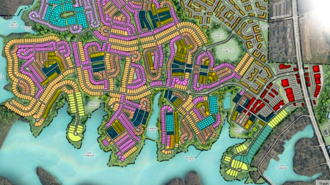 An image of a massive planned subdivision on a huge lake south of Atlanta with many shops and businesses included.