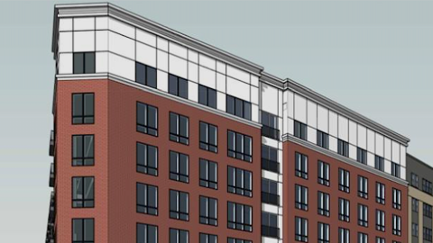 A rendering showing a red brick and white building under gray skies over wide streets north of Atlanta.