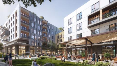 A rendering of a large gray and white new building with a lawn and many shops and a cafe.