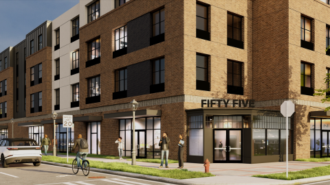 A site where a large brick and stucco housing development is planned with retail under blue skies in East Point, south of downtown Atlanta.