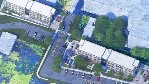 Overview of an affordable housing project near a large resevoir and two streets and a large apartment block in Atlanta.