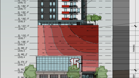 A rendering showing a large new building with a fire station at the base under blue skies in Atlanta near a wide street.