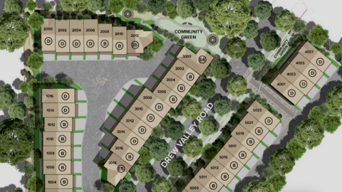 An image of a large site where townhomes are proposed near many trees and a wide highway north of Atlanta.