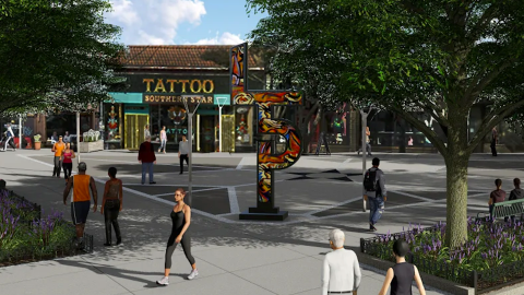 An image of a new open plaza with many trees and events space in Atlanta near many businesses and wide streets.