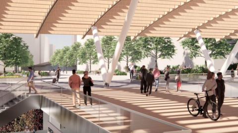 An image of a modernized train station in downtown Atlanta shown with large trees and plazas near an escalator.