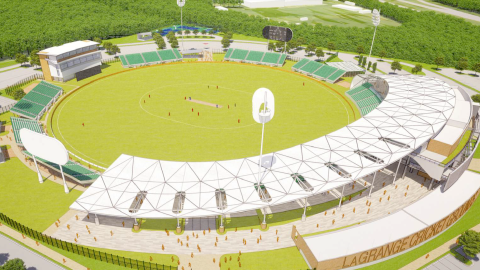 A render of a large green cricket stadium near many trees and a wide parking lot southwest of Atlanta near forests.