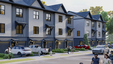An image of a large townhomes site with three-level units with dark blue and gray exteriors and pointed roofs east of Atlanta. 