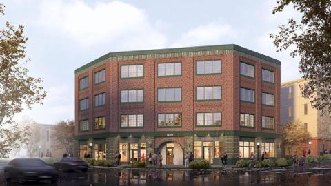 A rendering of a large new building under blue gray skies near wide streets in Atlanta.