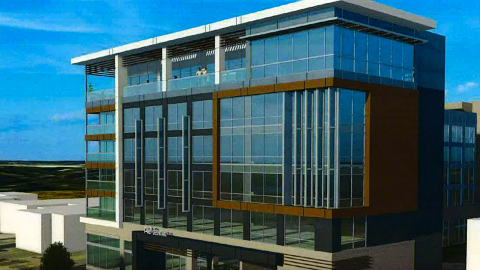 an overview image of a site for a glassy and modern new hotel under blue skies near downtown Decatur Georgia. 