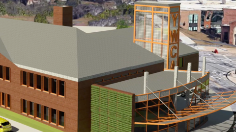 A rendering of a brick building near wide streets and many buildings in downtown Atlanta.