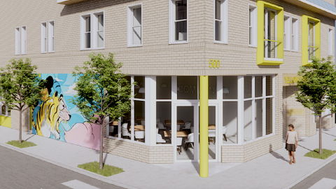 A rendering of a brick corner building with yellow flourishes with a store at the bottom and apartments on top on Atlanta's Westside.