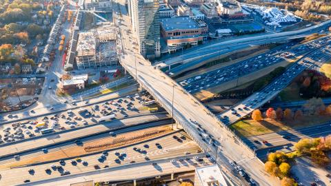 An aerial photo of a large tangle of highways in Atlanta near Atlantic Station and Midtown.