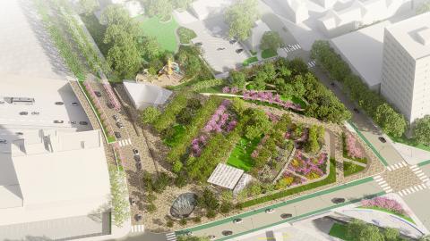 An overview of a large new park over a highway in Atlanta with many tall buildings around plus trees and a playground. 