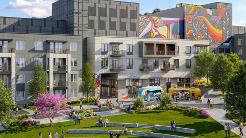 A rendering showing a large new mixed-use community in Atlanta with huge murals and a greenspace with many trees.