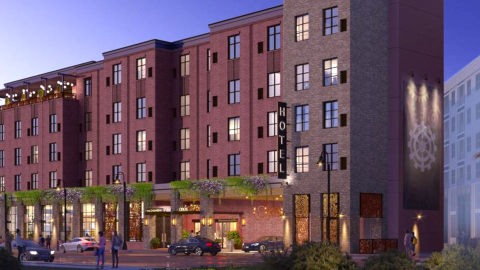 A rendering of a large brick hotel with rooftop restaurant space under purple-blue skies north of Atlanta.