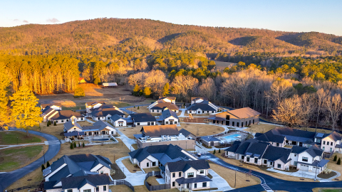 A photo of a large new housing complex with a pool and chapel and workplaces on a wooded property northwest of Atlanta in Rome Georgia on a huge college campus. 