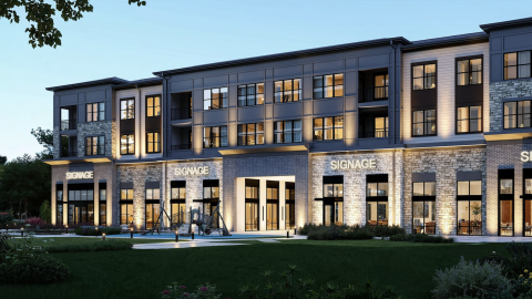 Image of a mixed-use development with several stories and retail and a pool in the middle under dark blue skies between Atlanta and Athens.