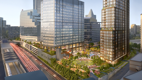An image showing a Buckhead tower site next to a MARTA line and highway under gray-blue skies in Atlanta.