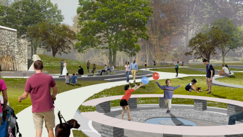 An image of a large greenspace at Atlanta's oldest park, Grant Park, near many trees and pathways.
