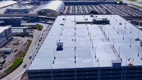 An aerial photo of a huge new parking deck at Atlanta's airport near big terminals and a large parking lot.