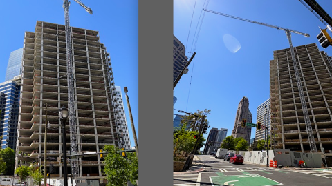 An image of a tall skeletal tower in Midtown Atlanta under blue skies with a large crane beside it. 