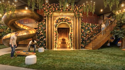 An image of a large whimsical setting in a big downtown Atlanta space with many golden colors and leafy areas. 